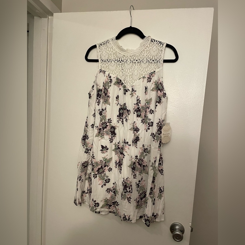 Never worn dress from altar’d state. Flowers are purple with pink. Size medium